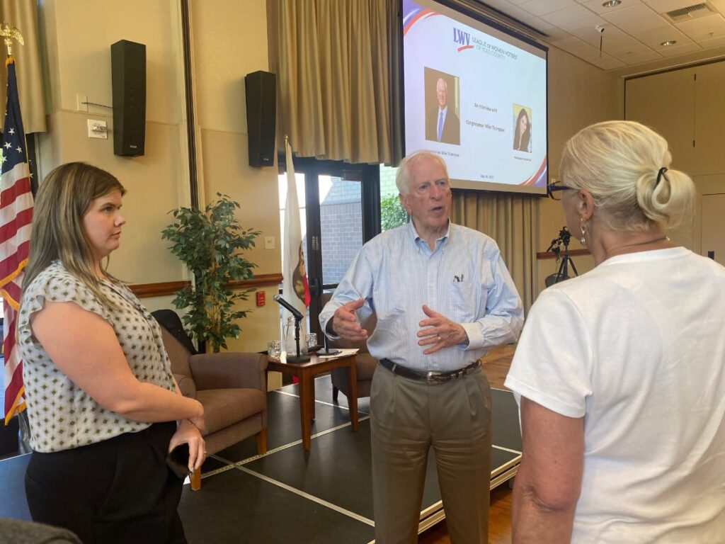 Rep Mike Thompson talking to two women constituents of Yolo County