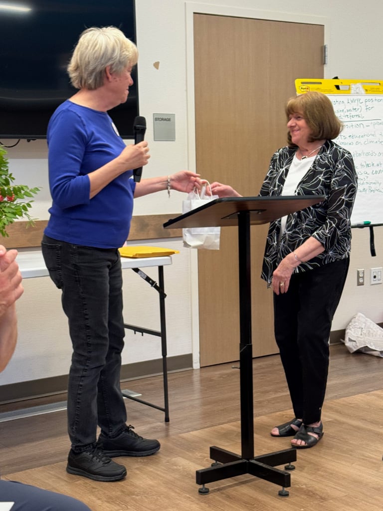 Women handing out and receiving awards at the Yolo County LWV Annual meeting.