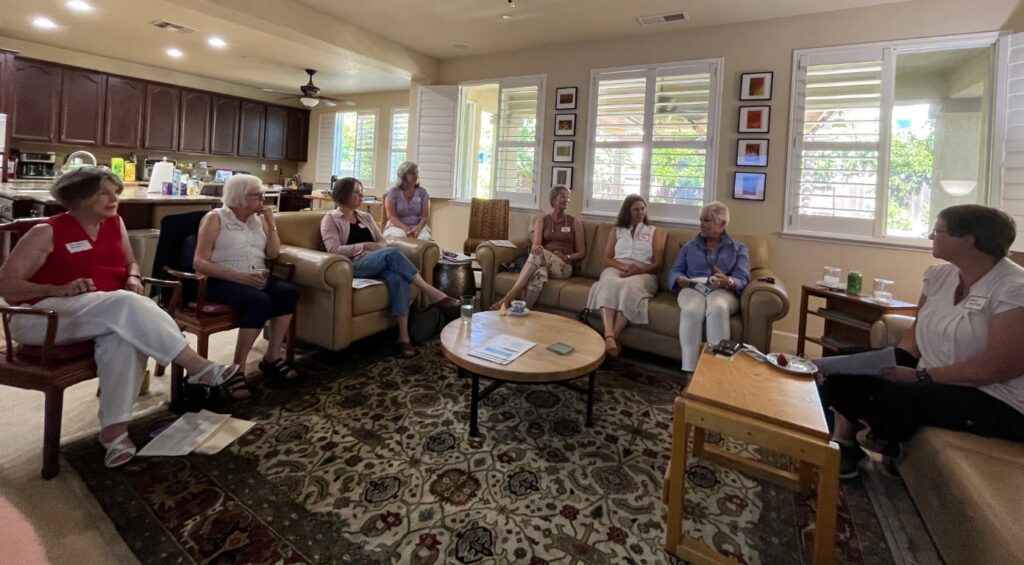 Eight women in a living room