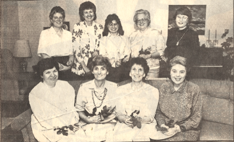 Nine women in a living room in the 1970s. LWV Board Members.