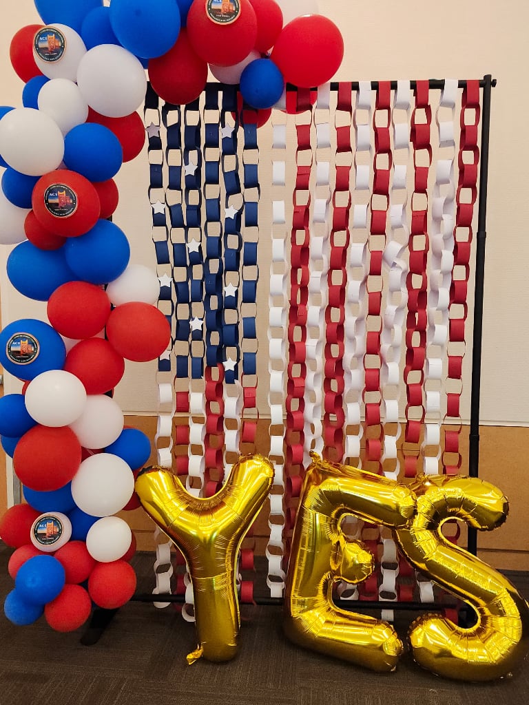 Red, white and blue balloons and construction paper rings for photo background