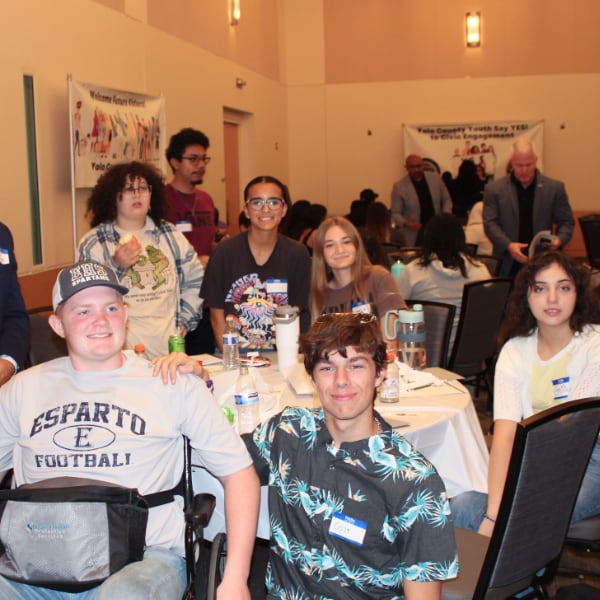 Young people around a table at the 2024 Youth Empowerment Event