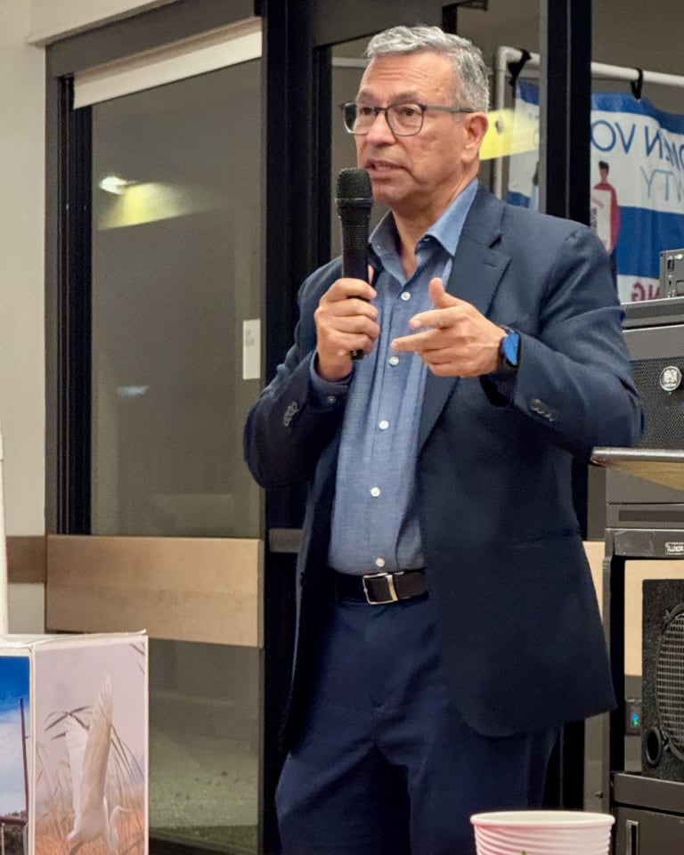 Man with microphone explaining something