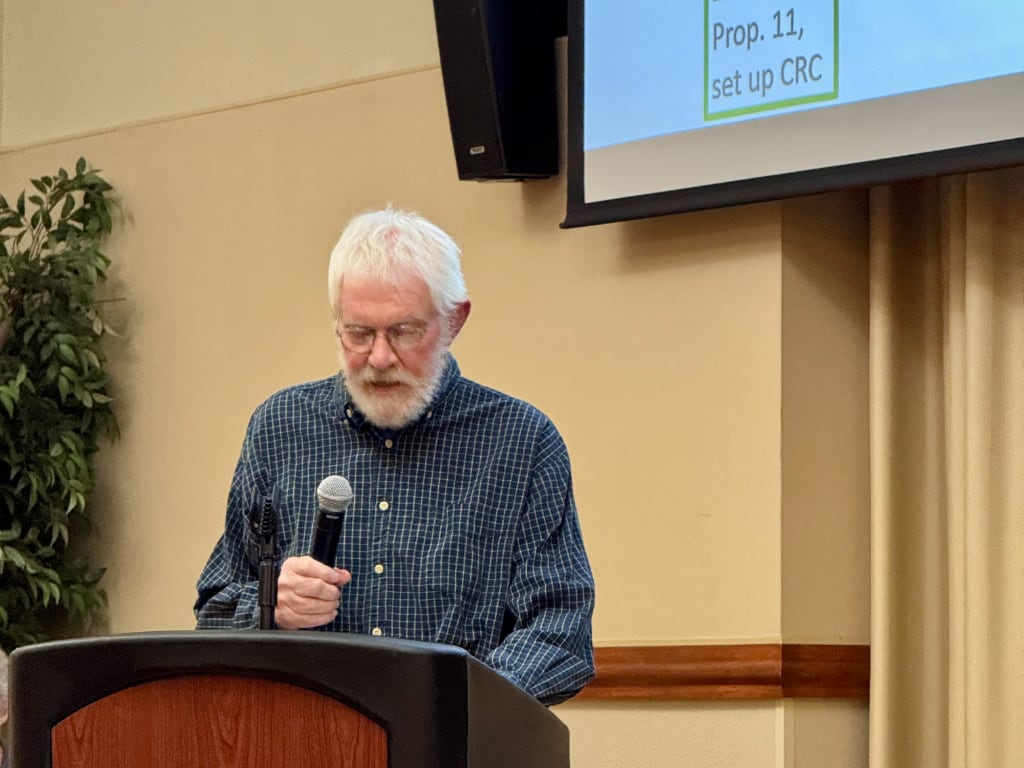 A man at a podium with a microphone
