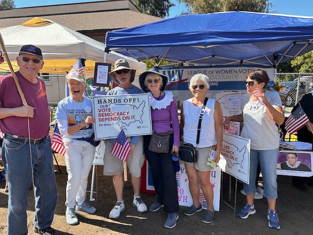 Six League members with Democracy signs