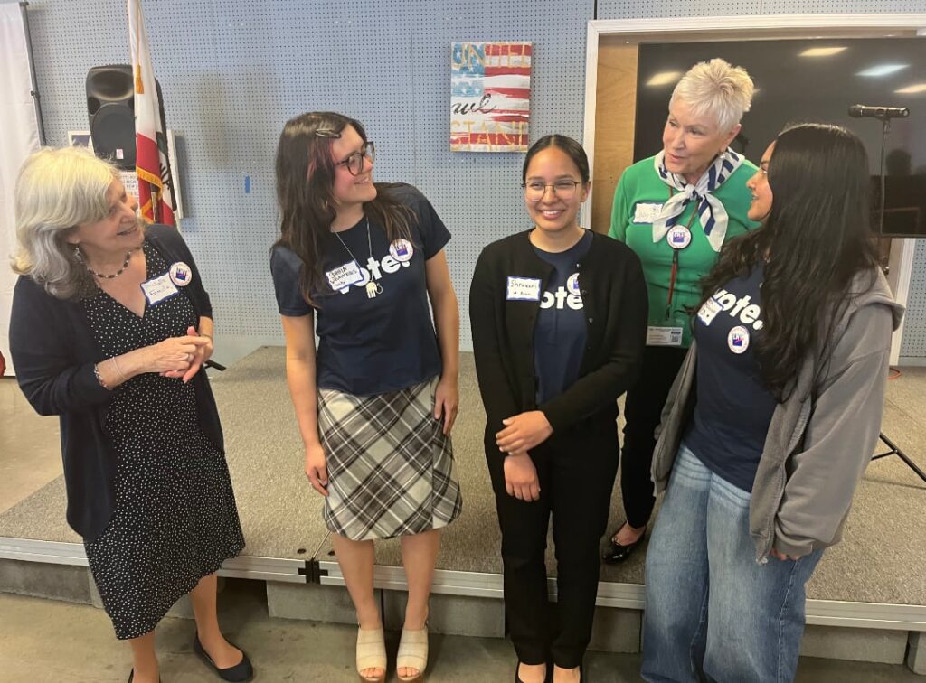 Two senior members of the LWV of Yolo County with three UC Davis Club members
