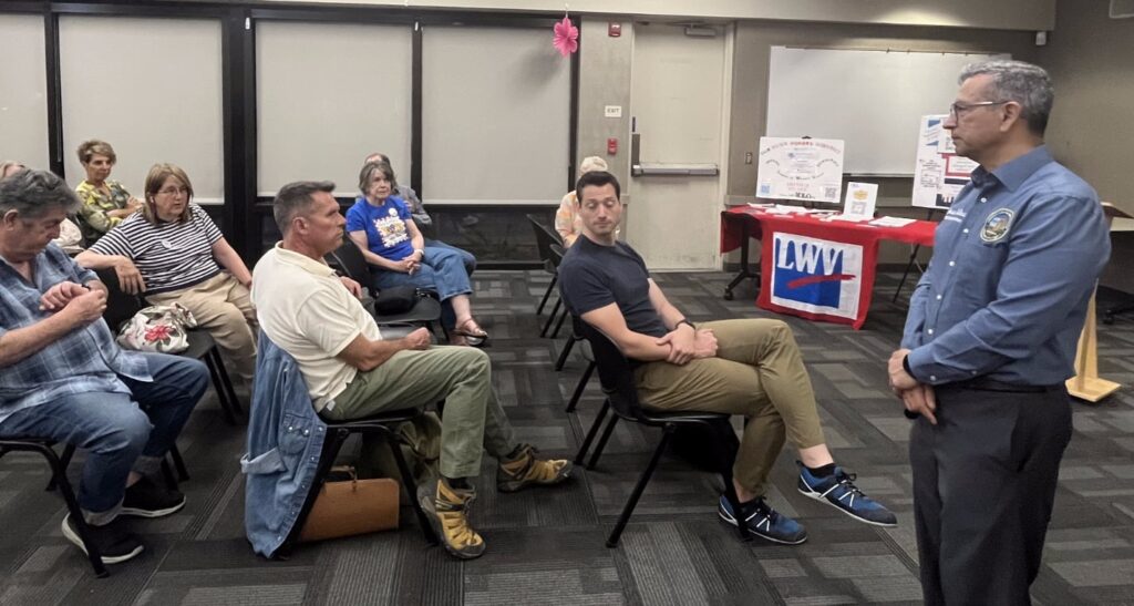 A small audience listening to Jesse Salinas