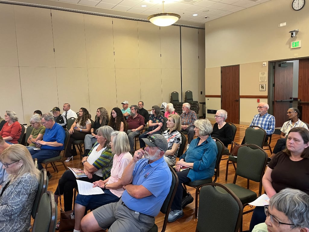 A room full of local citizens waiting for a forum to start